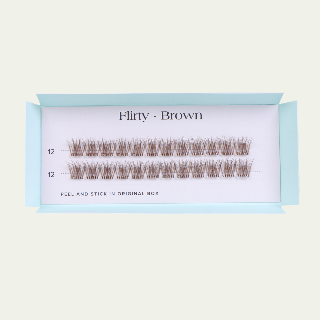 Eyelash packaging labeled 'Flirty - Brown' on a light blue background