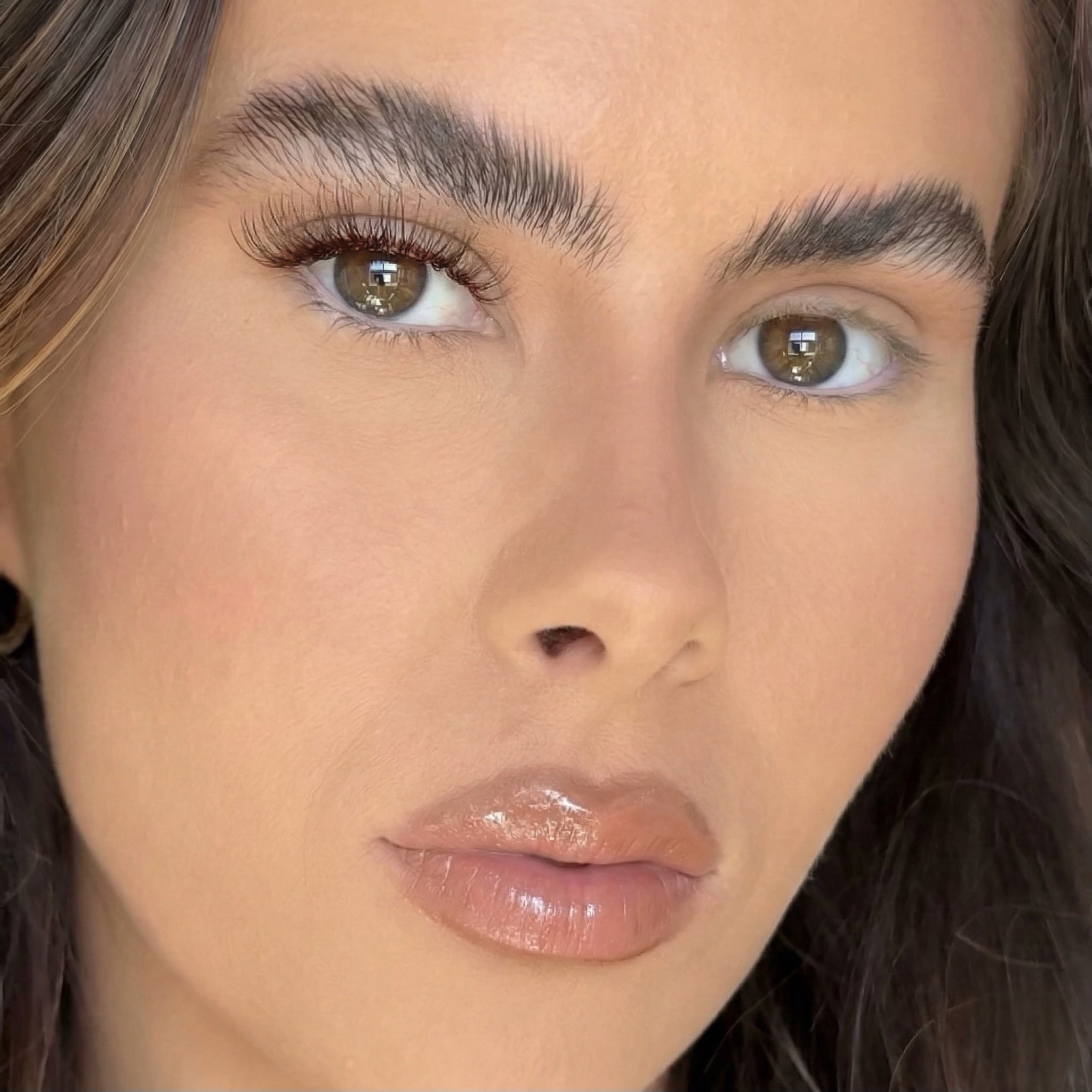 Close-up of a person's face with a neutral expression