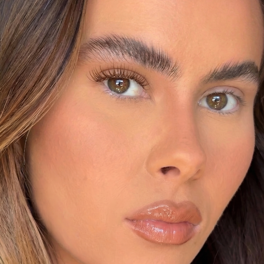 Close-up of a person with brown eyes and blonde hair.