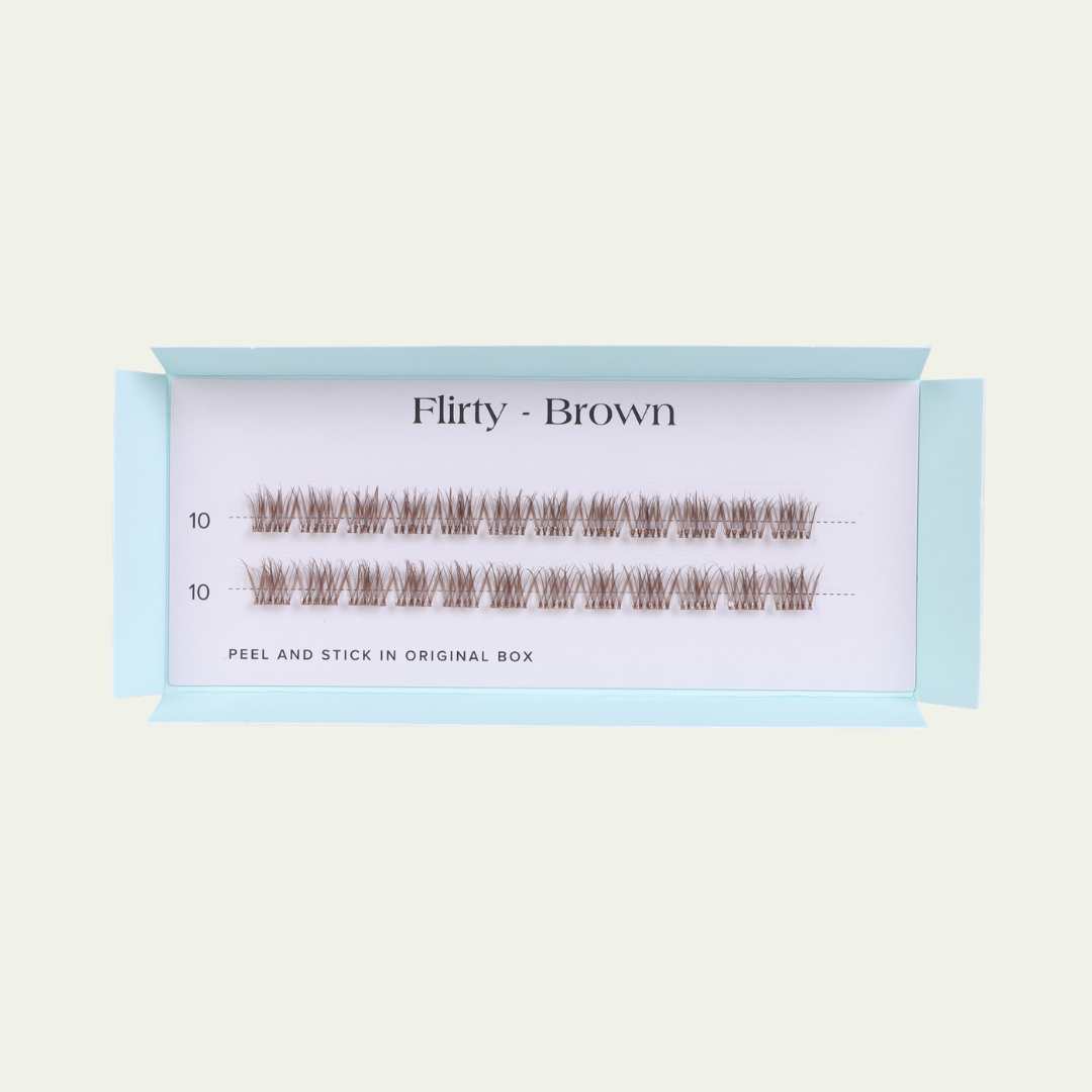 Eyelash extensions in a box labeled 'Flirty - Brown' on a light beige background