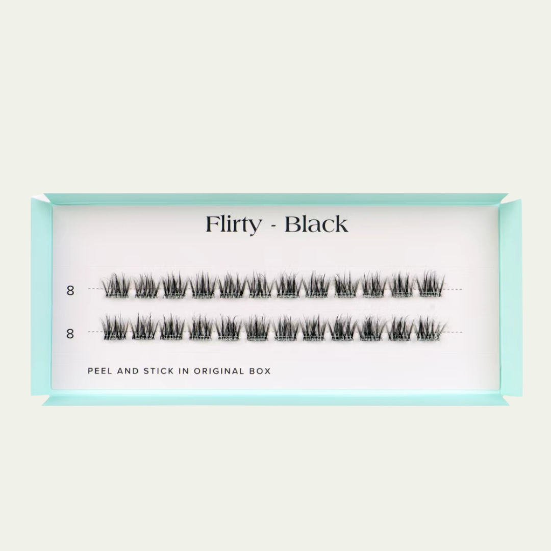 Pair of false eyelashes labeled 'Flirty - Black' on a light gray background