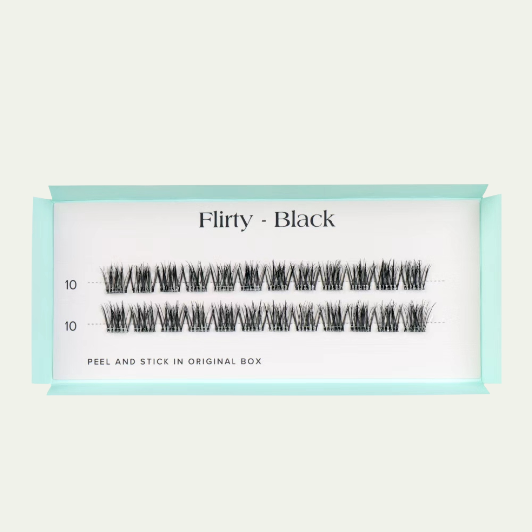 False eyelashes packaging labeled 'Flirty - Black' on a light beige background
