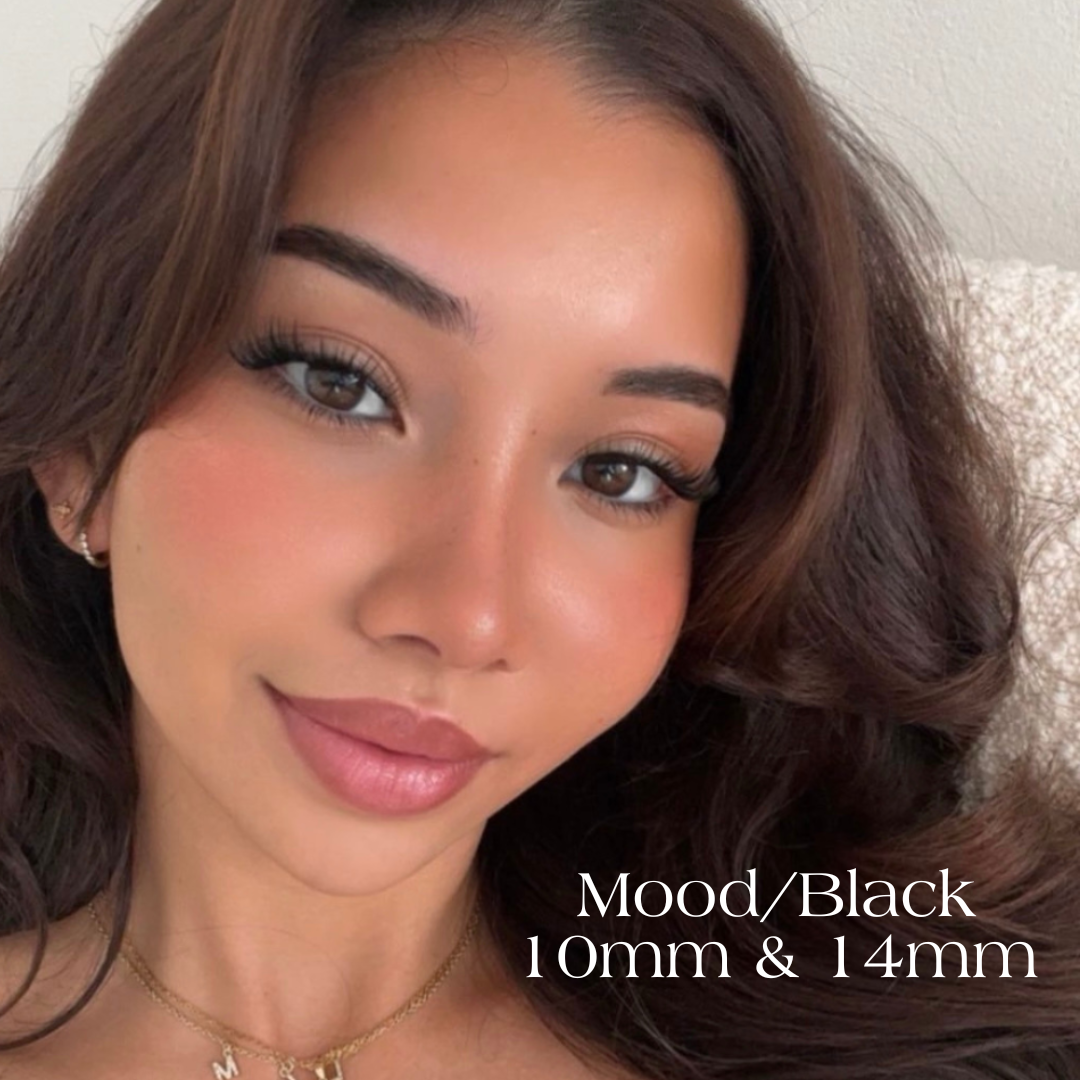 Model wearing mood lashes in black in sizes 10mm and 14mm with her hair down