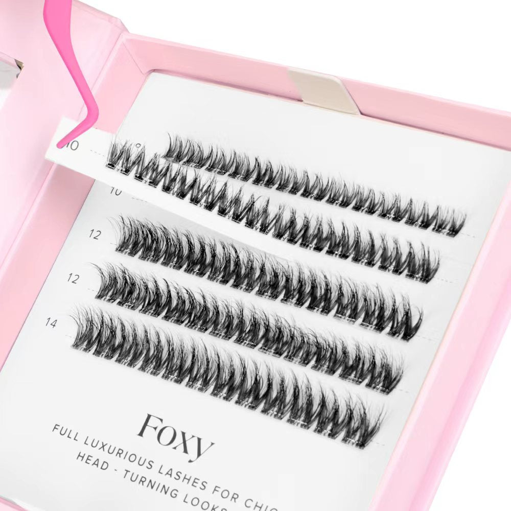 Set of false eyelashes in a pink case with 'Foxy' branding.