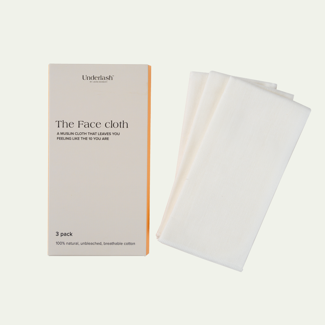 A pack of three white muslin face cloths next to their packaging, labeled 'The Face Cloth'.