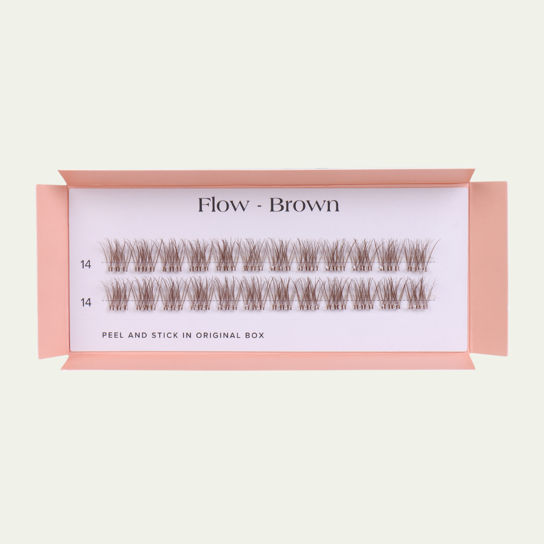 Box of false eyelashes labeled 'Flow - Brown' on a light beige background