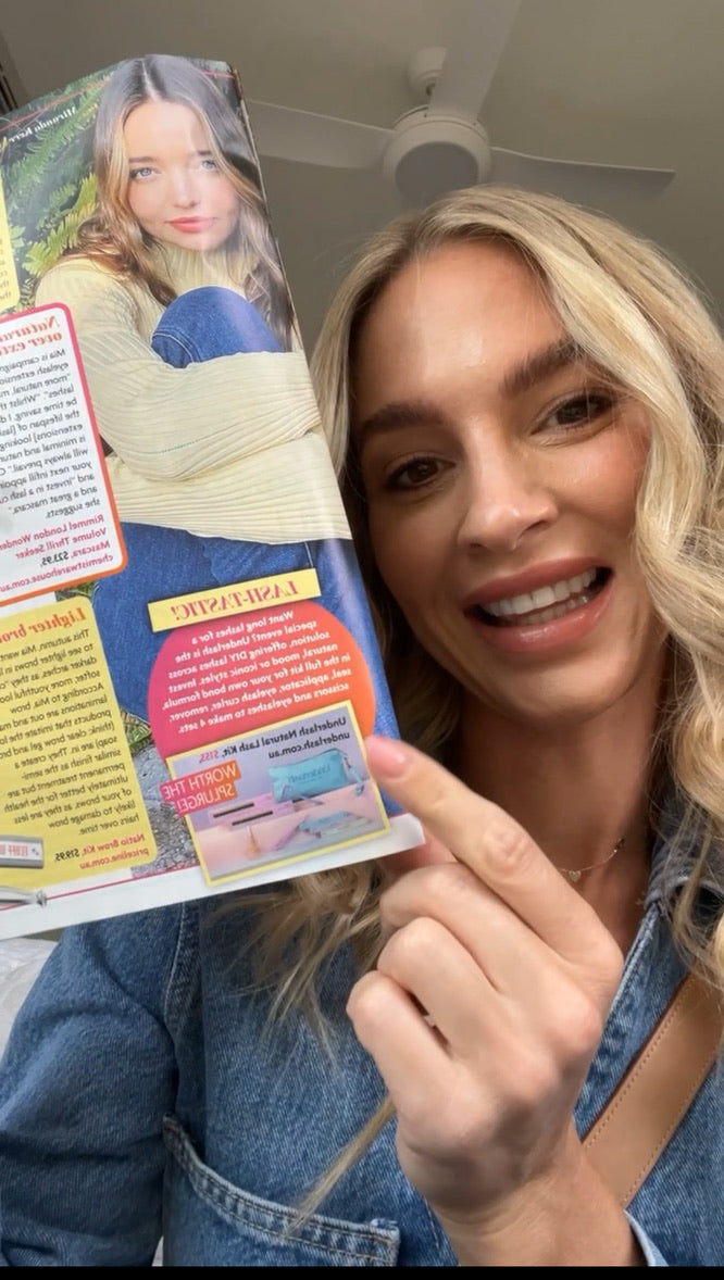Laura holding the New Idea beauty pages featuring Underlash