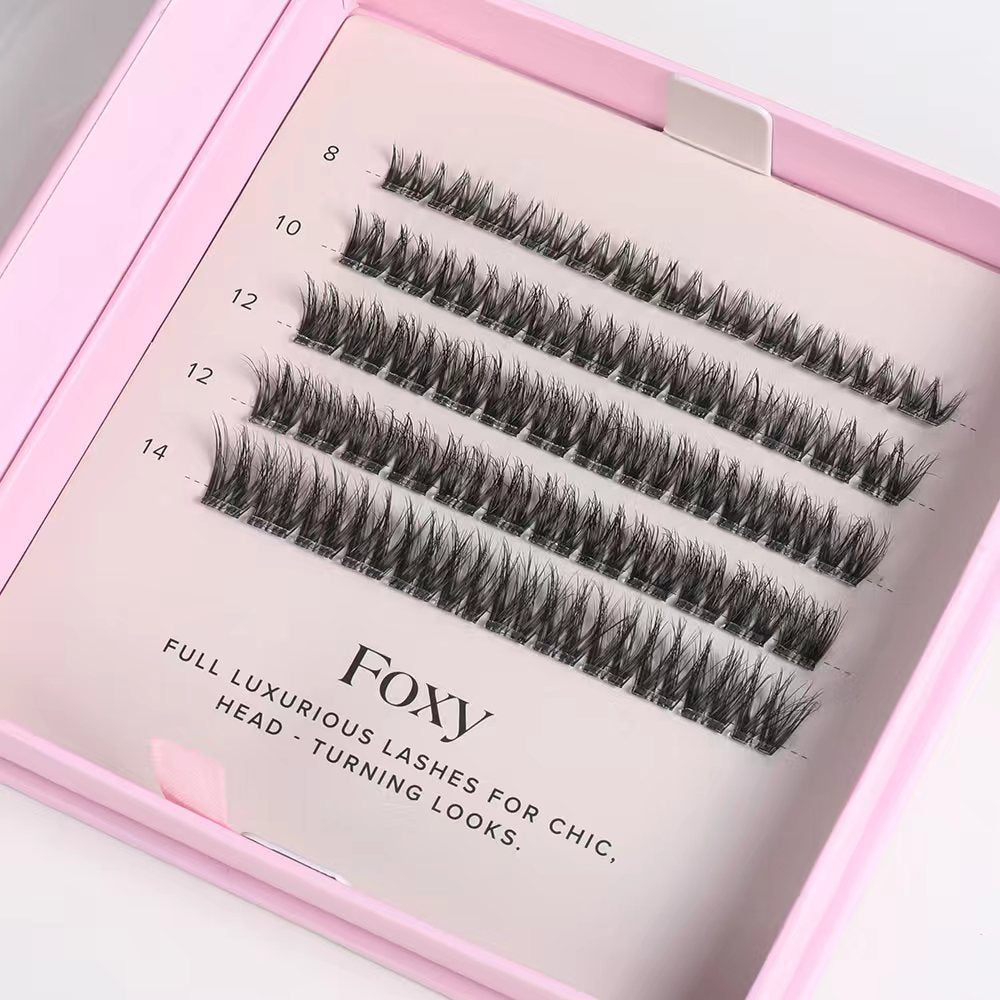 Set of false eyelashes in a pink box with 'Foxy' branding.