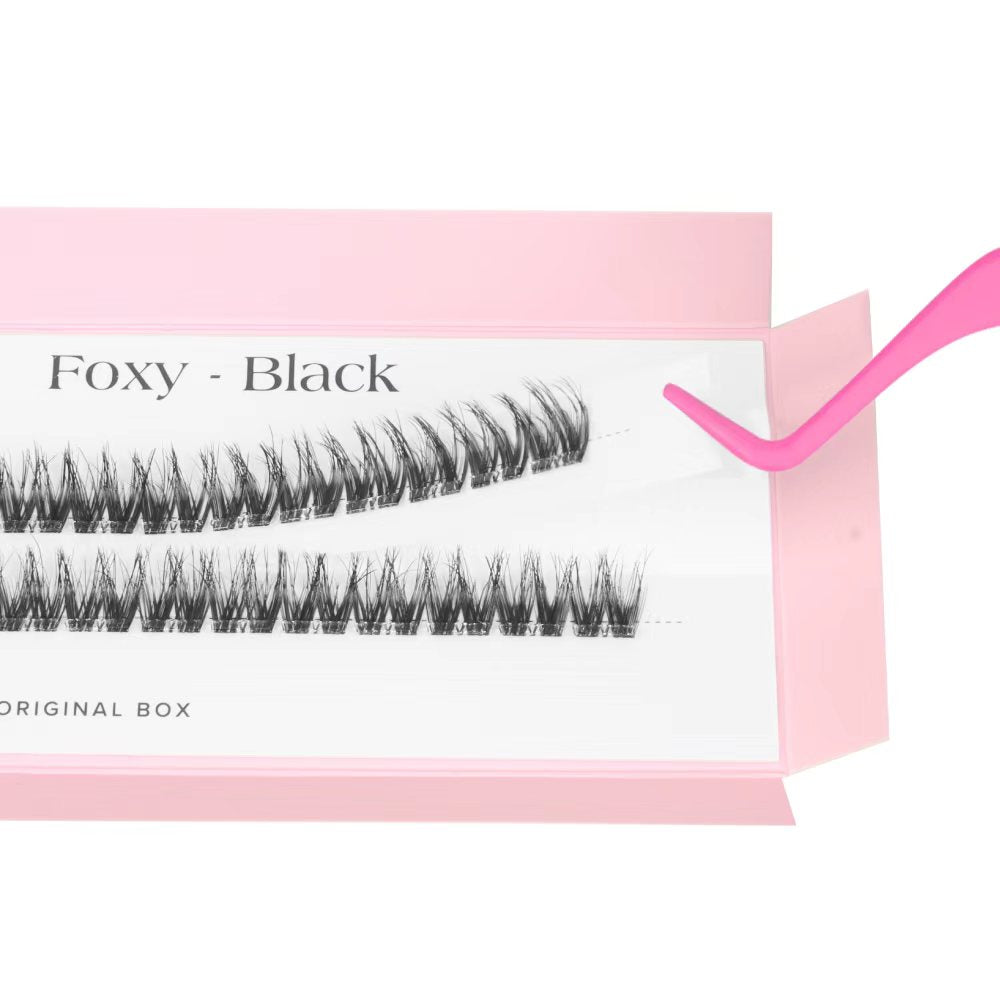 Faux eyelashes in a pink box with 'Foxy - Black' text.