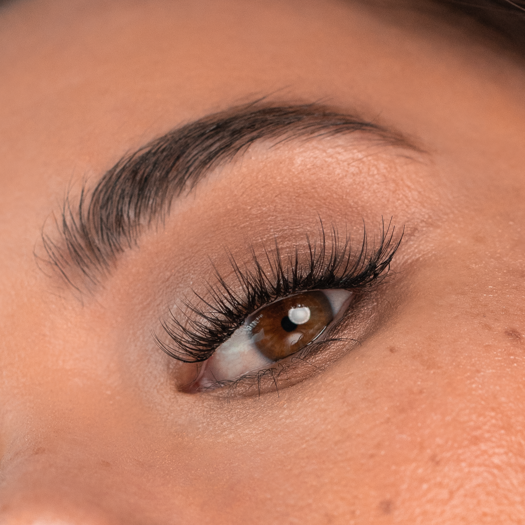 A close up picture of lady wear natural lash extensions. DIY Classic lash extensions applied yourself